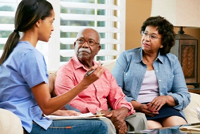 nurse orienting senior couple